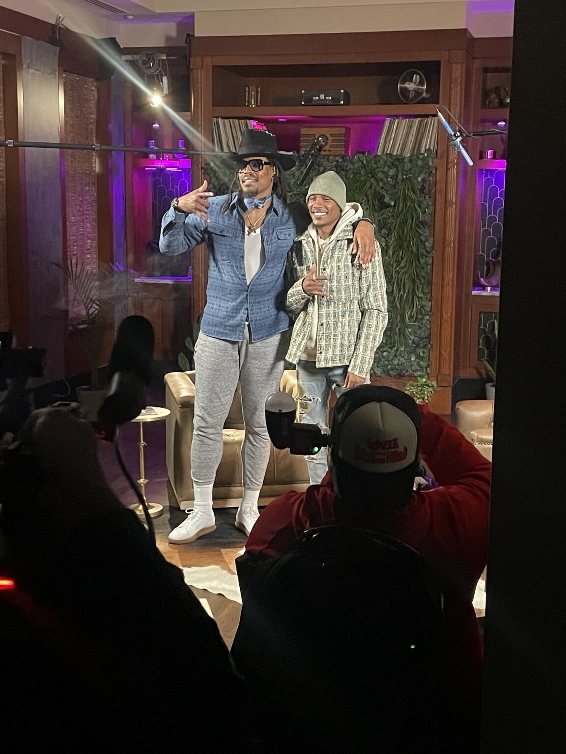 Artists posing together during a filmed production
