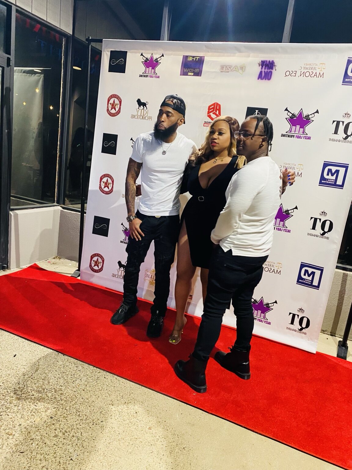 Guests posing at an entertainment media event